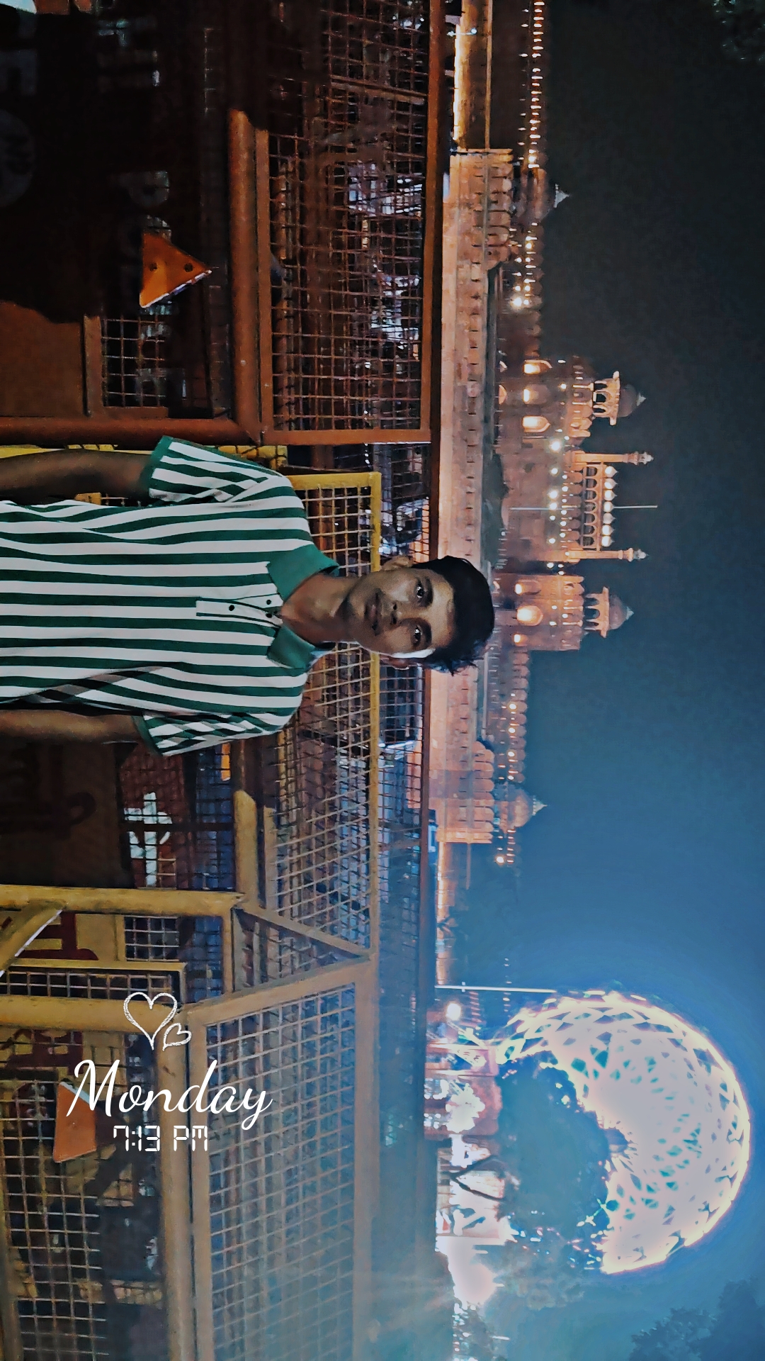 Ashish Alam Kabir near the illuminated Red Fort at night