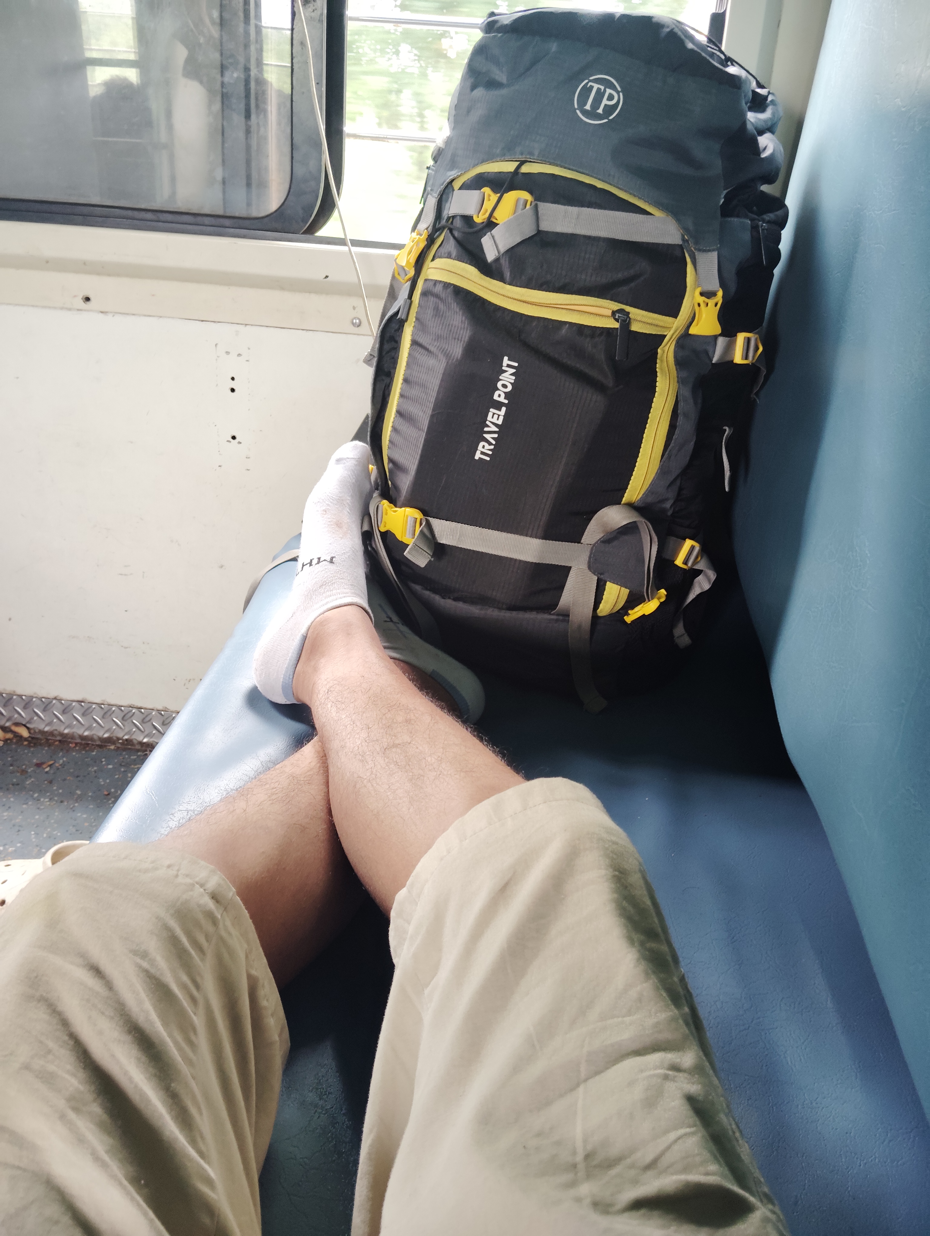 Travel backpack on a train seat during the Delhi journey